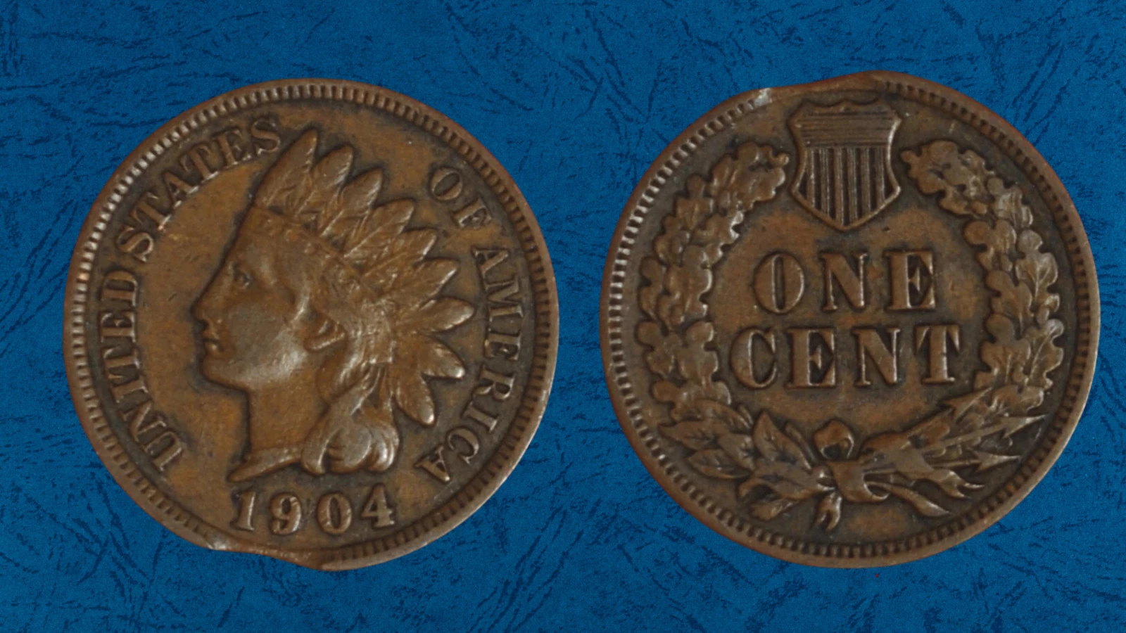 1904 Indian Head Penny clipped planchet error showing crescent-shaped void at coin edge where blank was incompletely punched